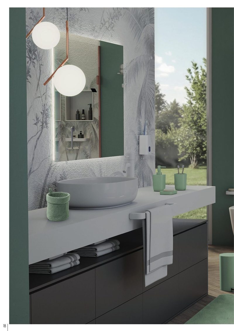 Ambiente de baño en acabado blanco mate, luminoso con pared verde salvia y vistas al jardín